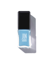 Blue nail polish bottle with black cap on a white backgroun