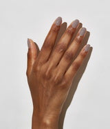 Hand with dark skin tone wearing JINsoon Milieu nail polish against a white background