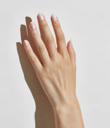 Hand model with JINsoon Akoya against a white background (Fair skin tone).