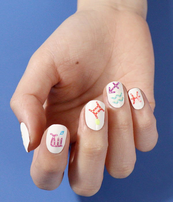 Hand model showcasing JINsoon Astrological Signs Appliqués with Absolute White as the base color.
