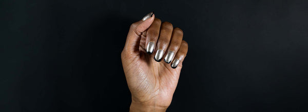 Hand showing Silver and Black Nail Design