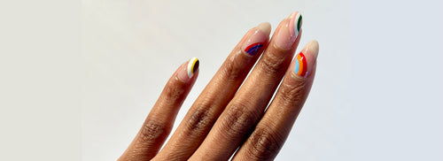 Dark skin tone hand showing colorful lines nail art using JINsoon Vanity, Aero, Dolly Pink, Cool Blue, Lavanda, Palma, Absolute White, Fire Clay, Hope and Tweety