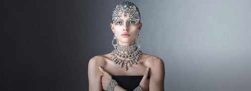 model posing with dark dress and silver jewerly 