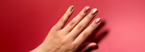 Gold and red polka dot nail art