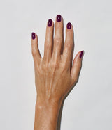 Hand with medium skin tone wearing JINsoon Fable nail polish against a white background