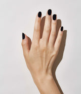 Hand model with JINsoon absolute black against a white background (Fair skin tone).