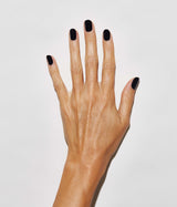 Hand model with JINsoon absolute black against a white background (Medium skin tone).